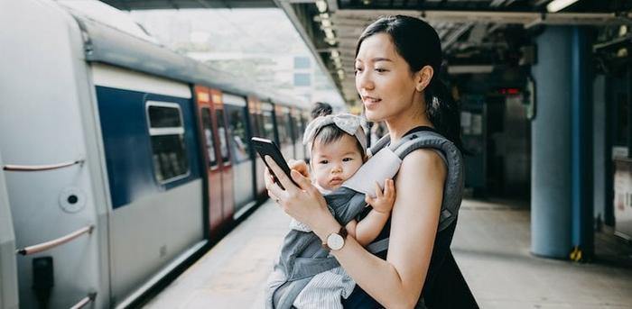 parent on phone with baby