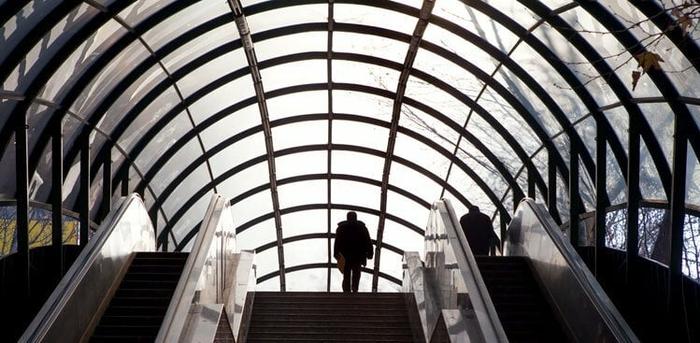 person on escalator