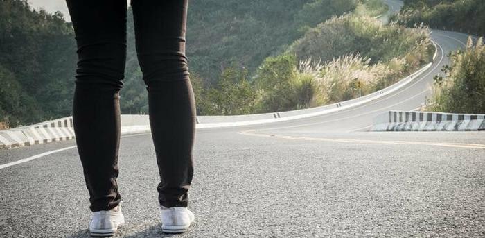 person standing in road