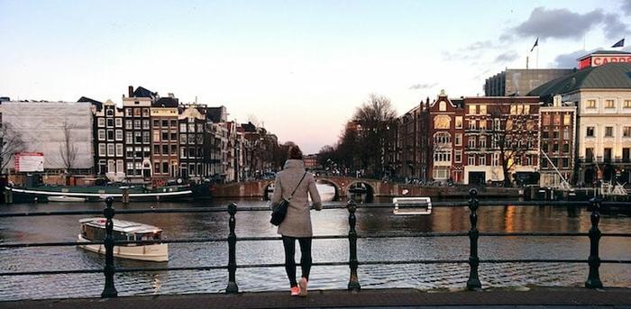 photo of girl overlooking canal