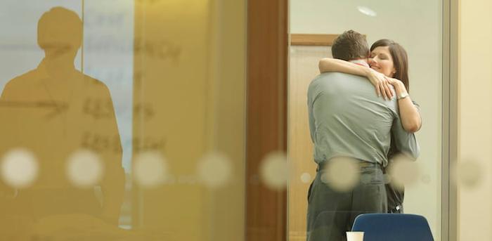 co-workers cuddling courtesy Monty Rakusen/Getty Images