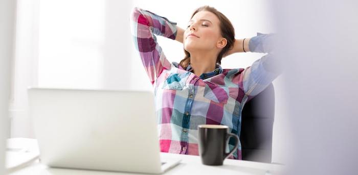 person relaxing at desk