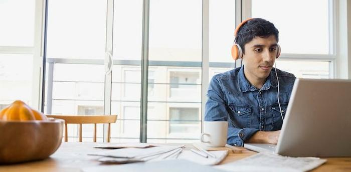 photo of man on laptop