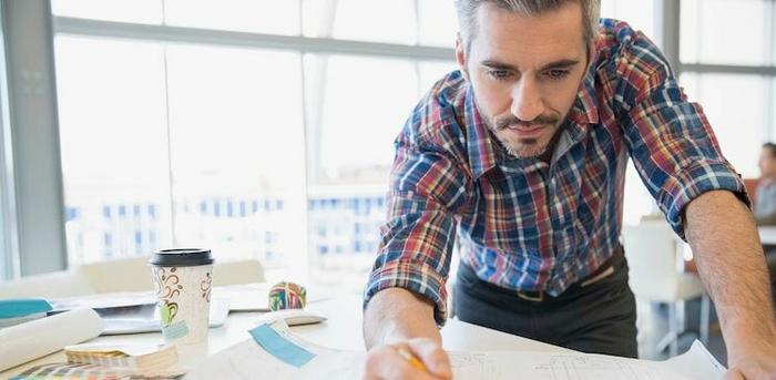 person drafting a plan