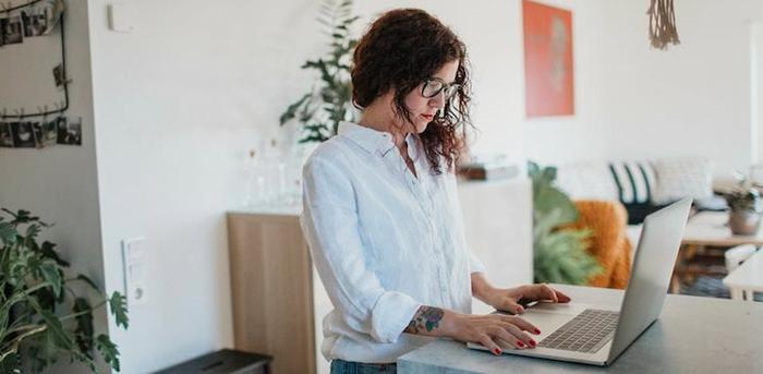 person on computer at home