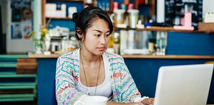 photo of woman on computer