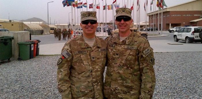 Carlos Perez (left) with a fellow service member