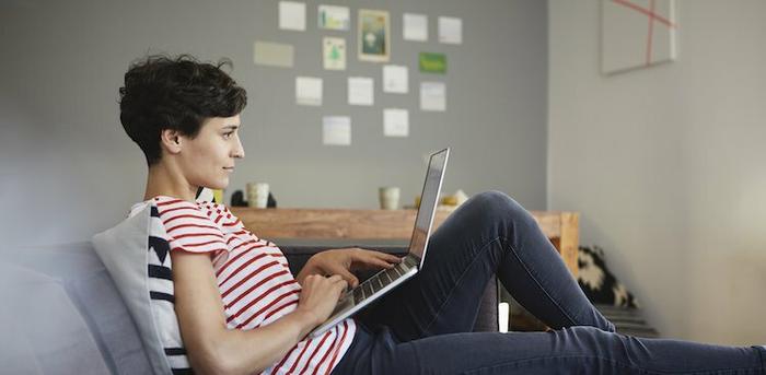 person working on laptop at home