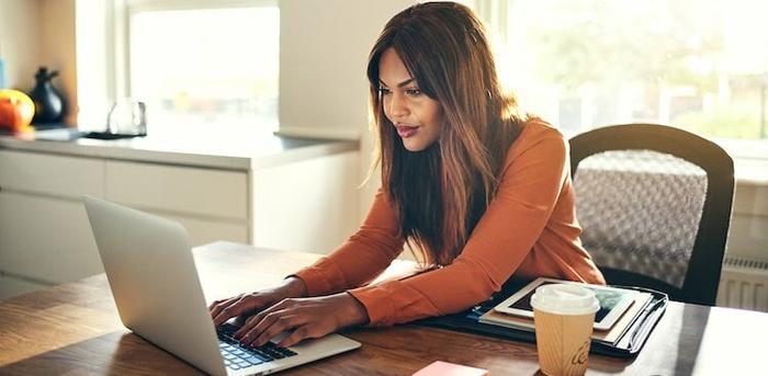 person working from home at kitchen table