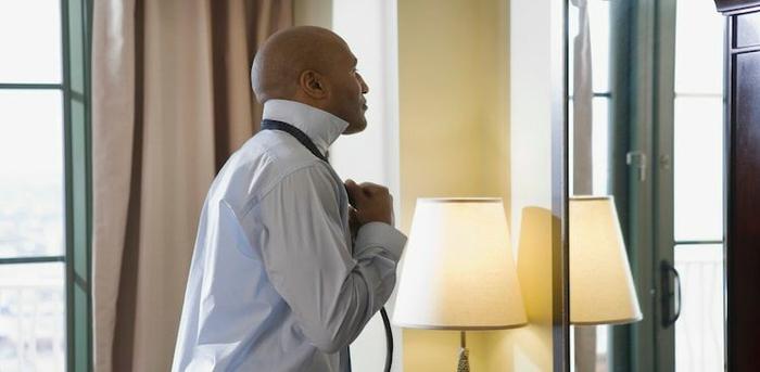 man getting dressed for job interview