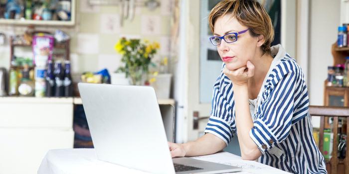 person at table on laptop