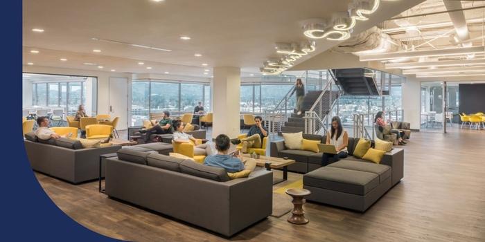 BlackLine employees hanging out on a cluster of couches at the company’s LA headquarters