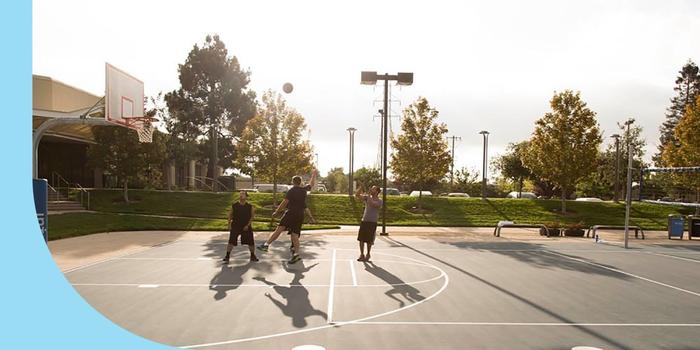 Intuit employees playing basketball at the company's Mountain View, CA, campus.