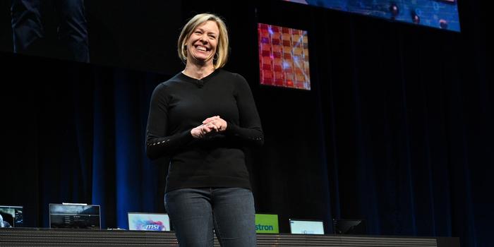 a blonde person giving a speech on stage at the technology conference CES