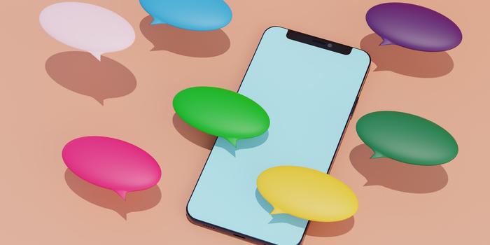 vector image of phone on peach background surrounded by three dimensional, multicolor speech bubbles