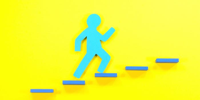 blue stick figure walking up steps against a bright yellow background
