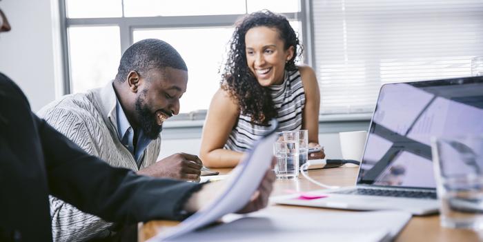 happy business people discussing in meeting at board room