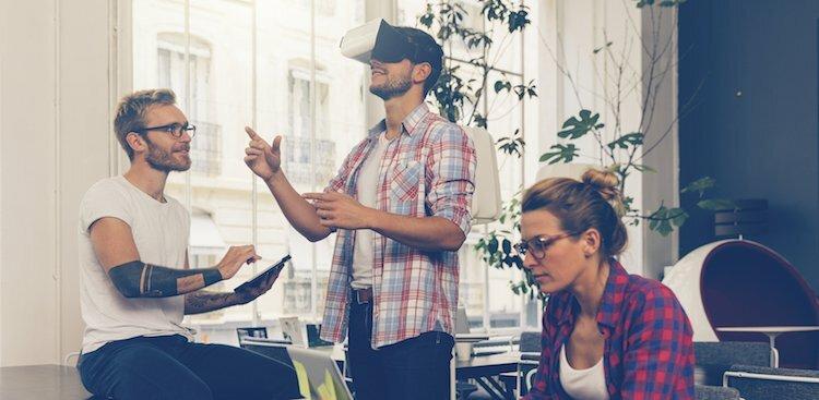 people using virtual reality headset in an office