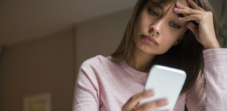 person stressed on phone