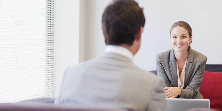 two people talking at a job interview in an office
