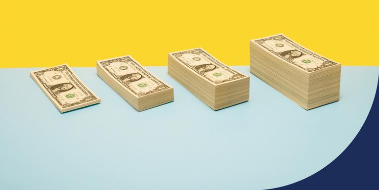 photo illustration of increasingly tall (from left to right) stacks of dollar bills against a yellow and blue background
