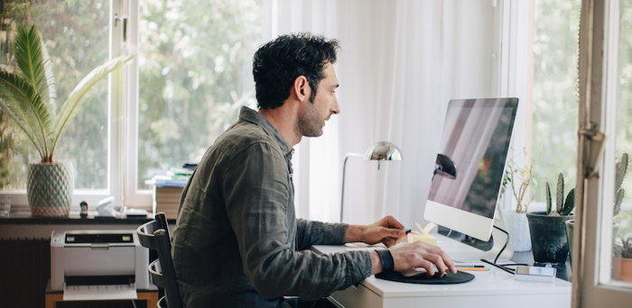person working on a computer at home