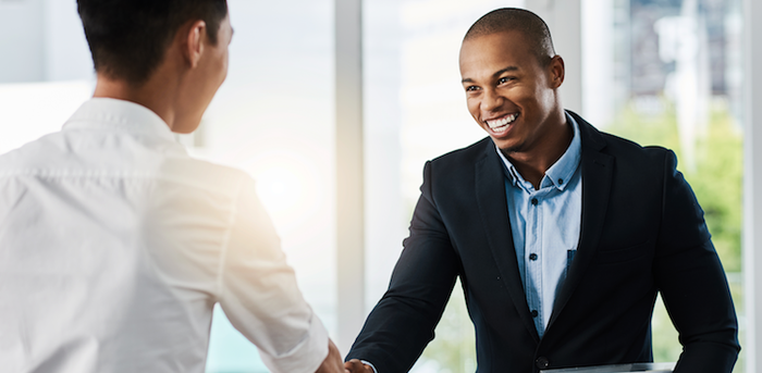 two people shaking hands