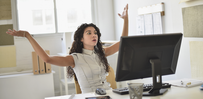 person staring at computer in frustration