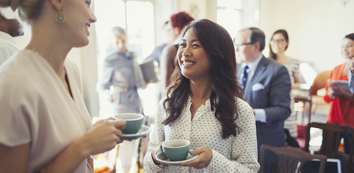 people talking at a networking event