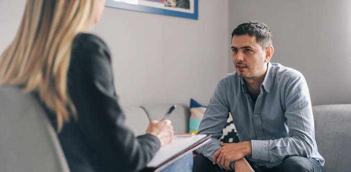 person sitting in a therapy session