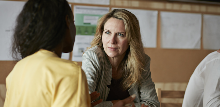 person listening to a colleague