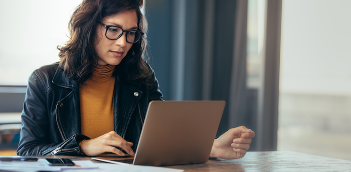 person sitting in front of a laptop