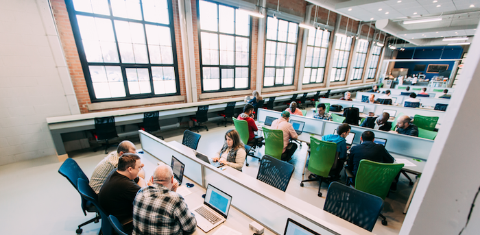 people working in an open office