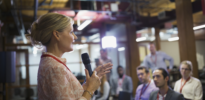 person speaking in front of an audience