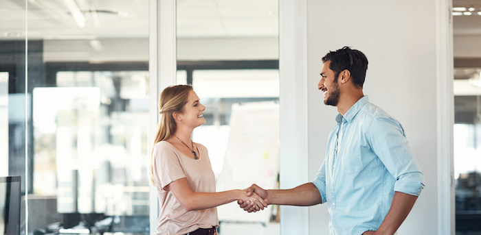 person arriving for an interview and shaking hands