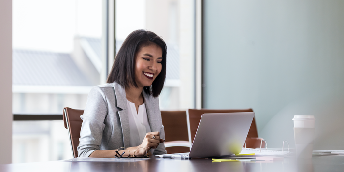 person sitting in front of a laptop during a video interview